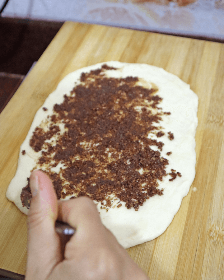 spread cinnamon mixture on dough