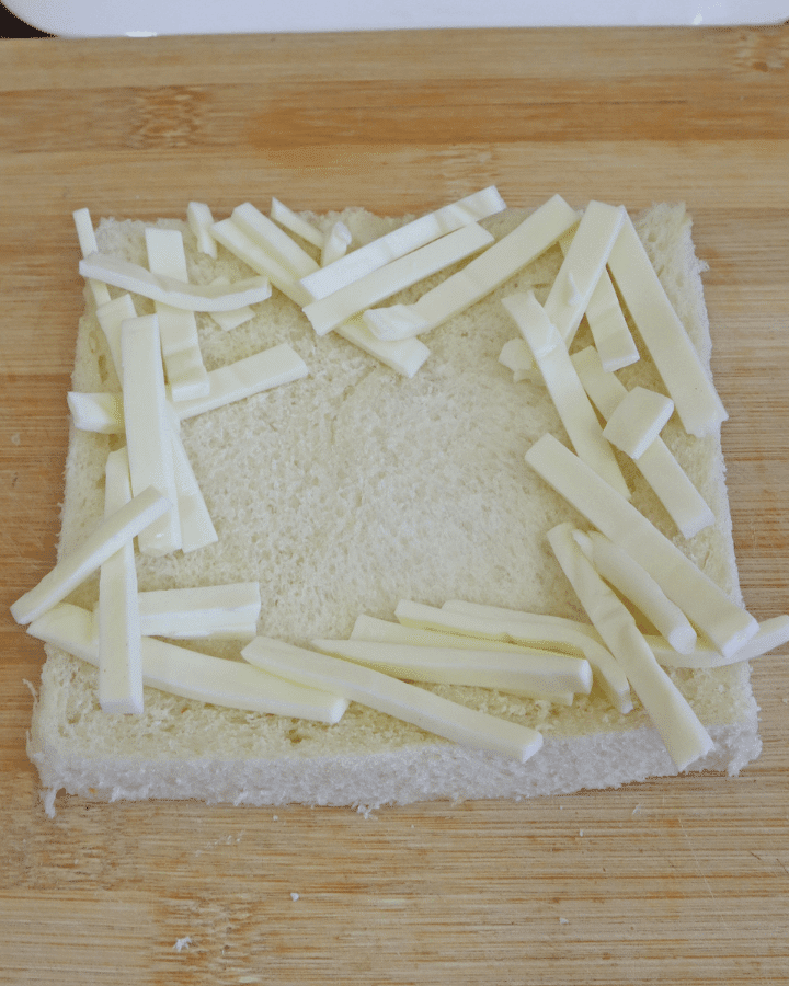 add cheese around edges of bread