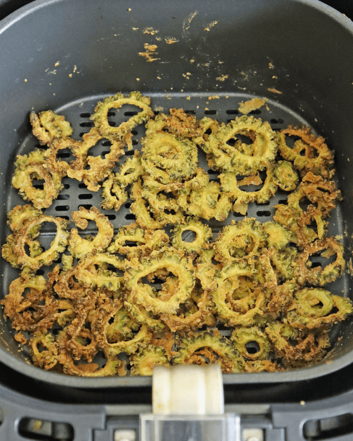 coated bitter gourd in air fryer tray