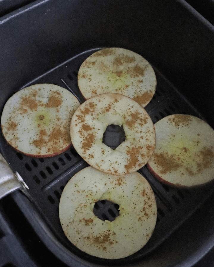 place apple slices into air fryer