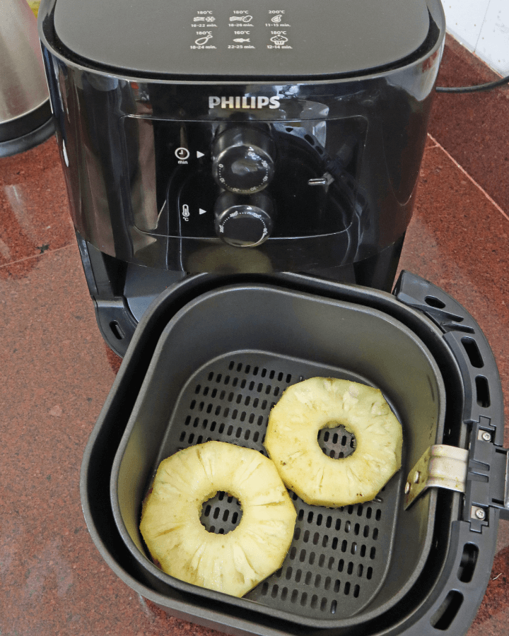 place coated pineapples in air fryer