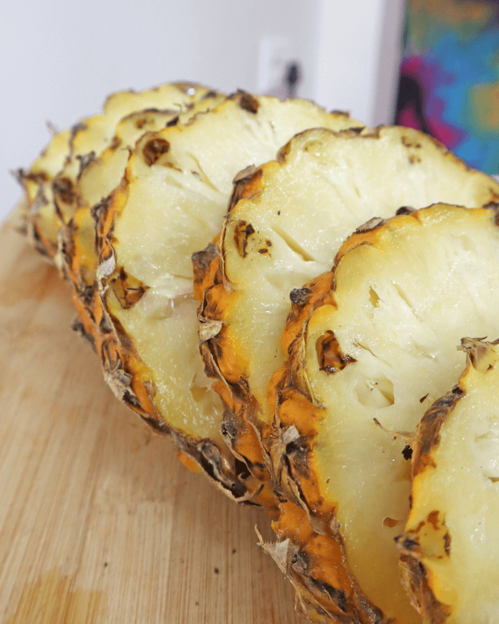 pineapple pieces on cutting board