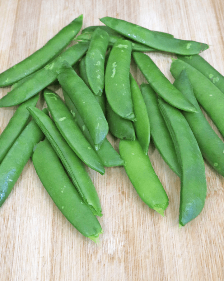 peas in chopping board