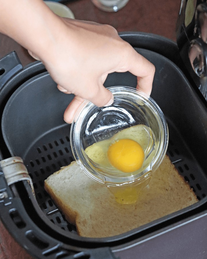 pour egg into middle of bread